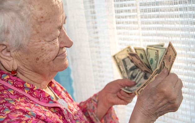 Person receiving grant check
